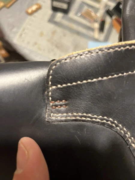 contrast-color stay stitches on a Derby boot upper before lasting